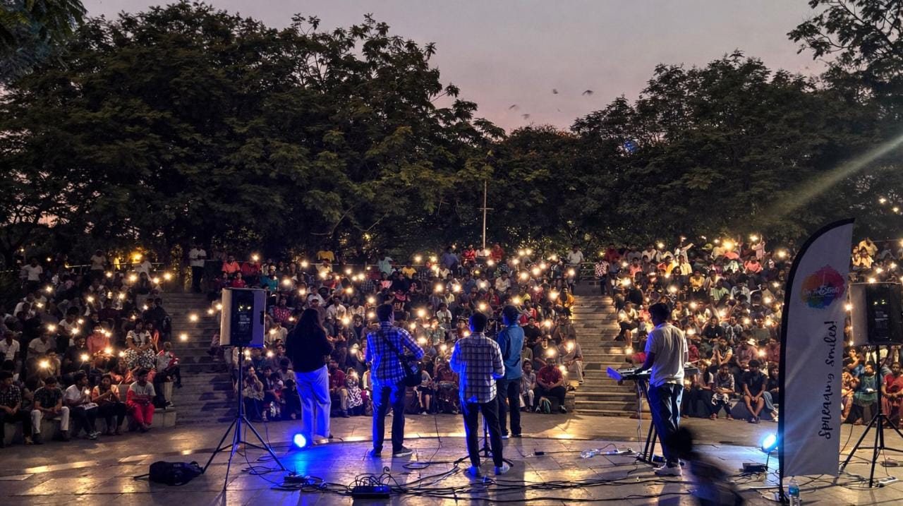 Stage lights over a packed show